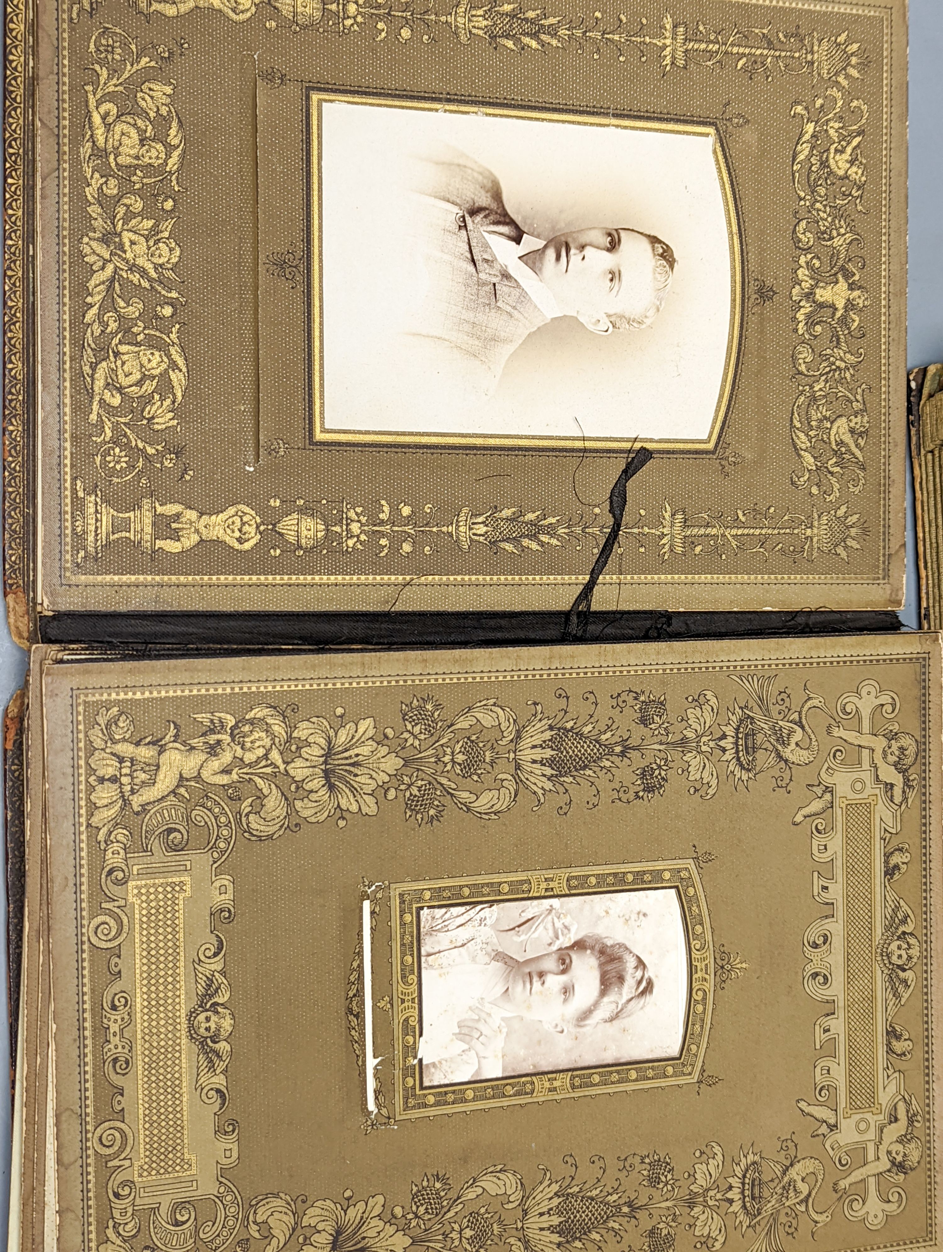 Two early 20th century postcard albums, a photo album and a collection of loose postcards